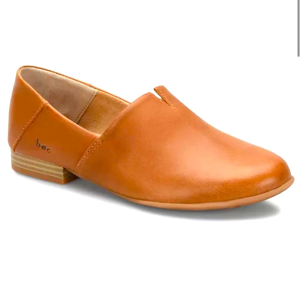 Brown leather slip on shoes.